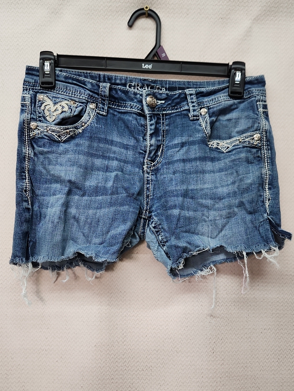 Grace Distressed Blue Denim Cutoff Shorts with Embroidered Pockets
